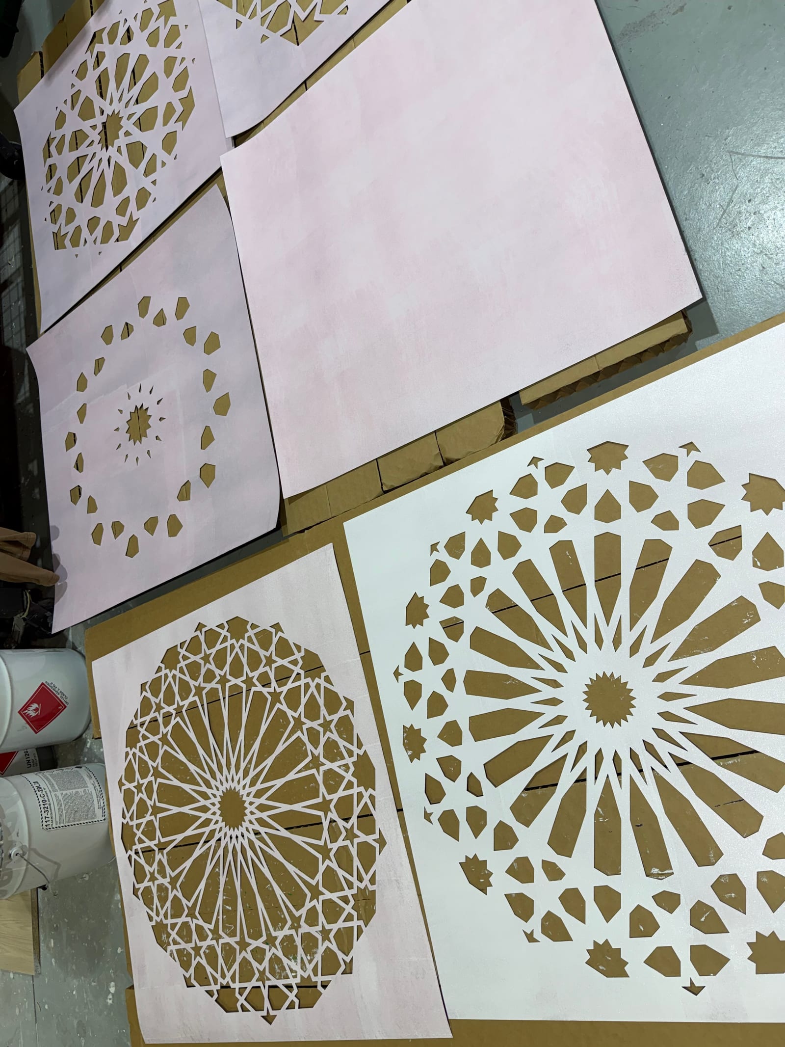 Stencil layers for Geometric Sunshine laid flat before painting.