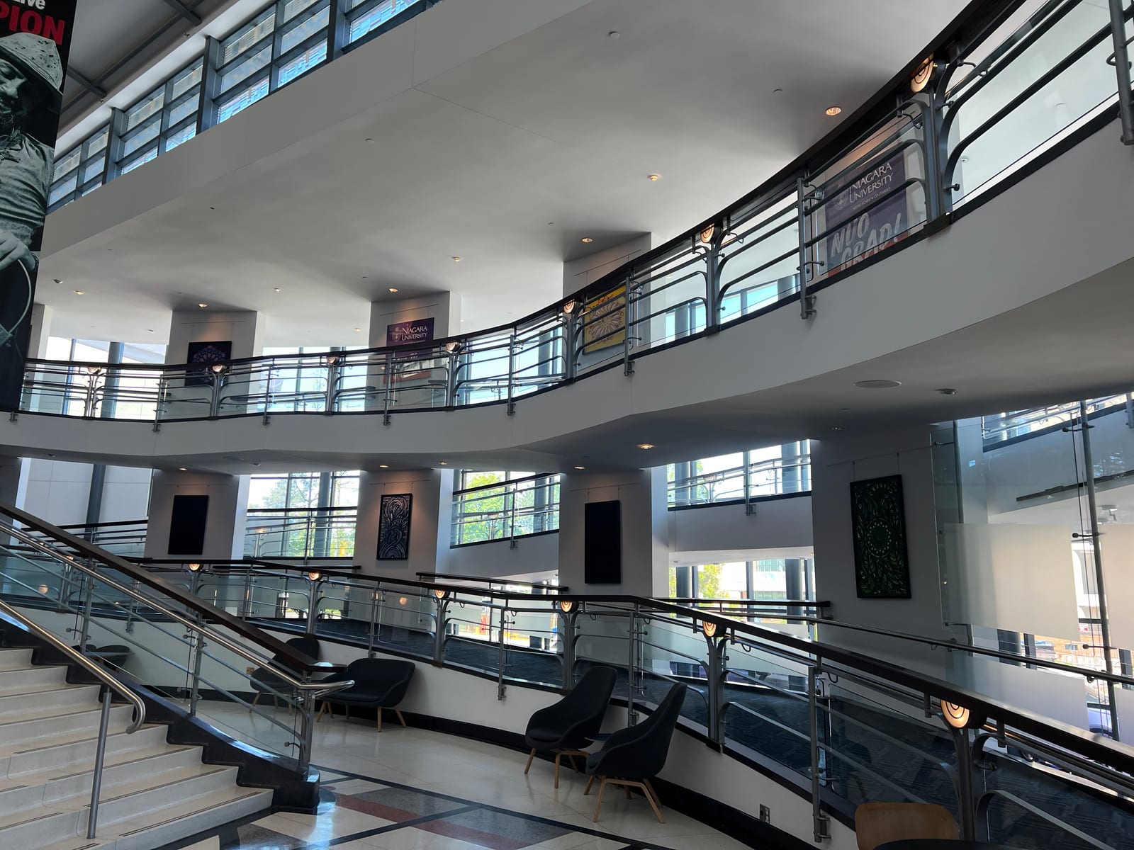 Wide shot of the Meridian Arts Centre atrium during install, multiple pieces visible.
