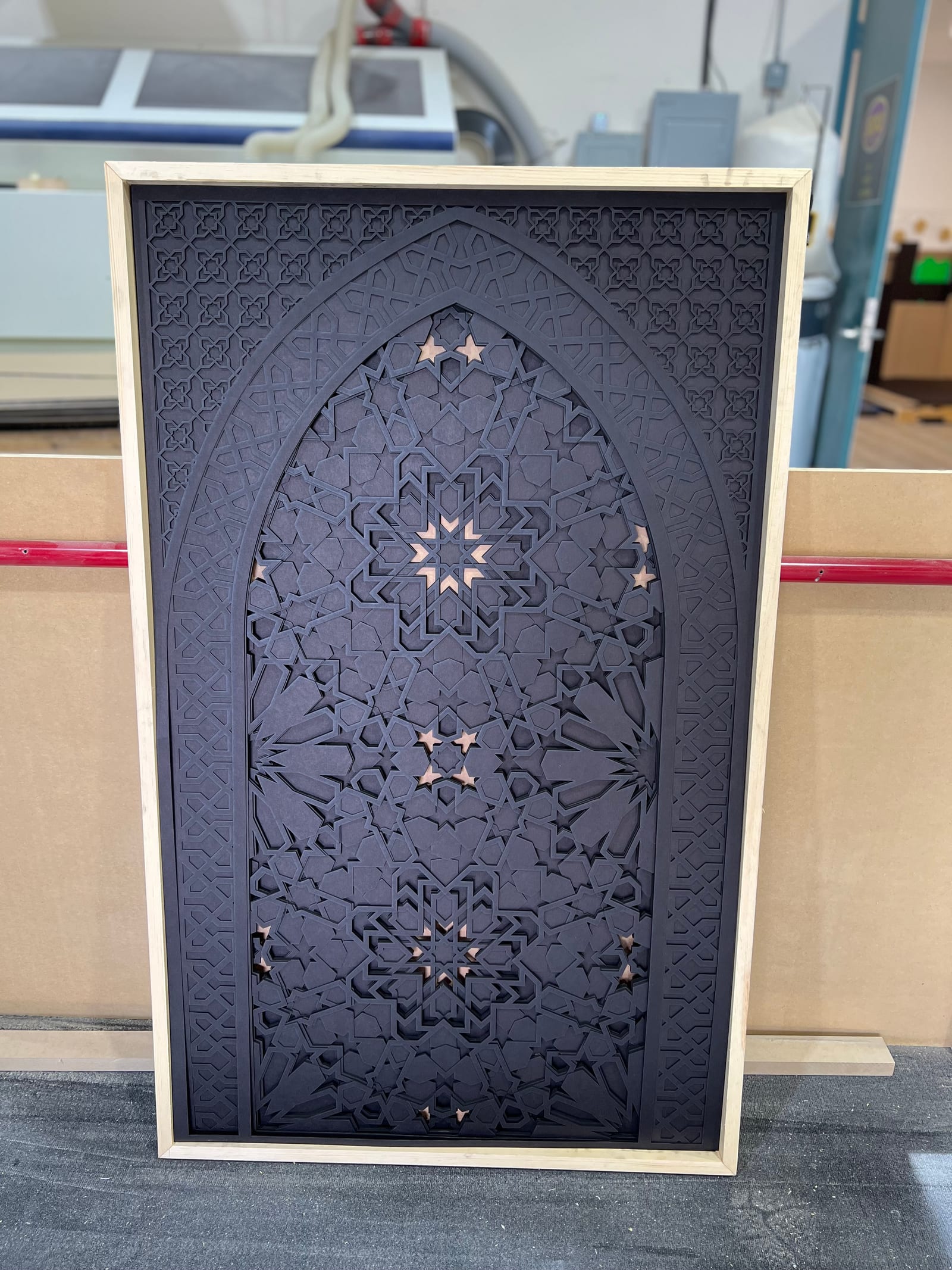 Moroccan Arch in finished black with copper-star inlays.