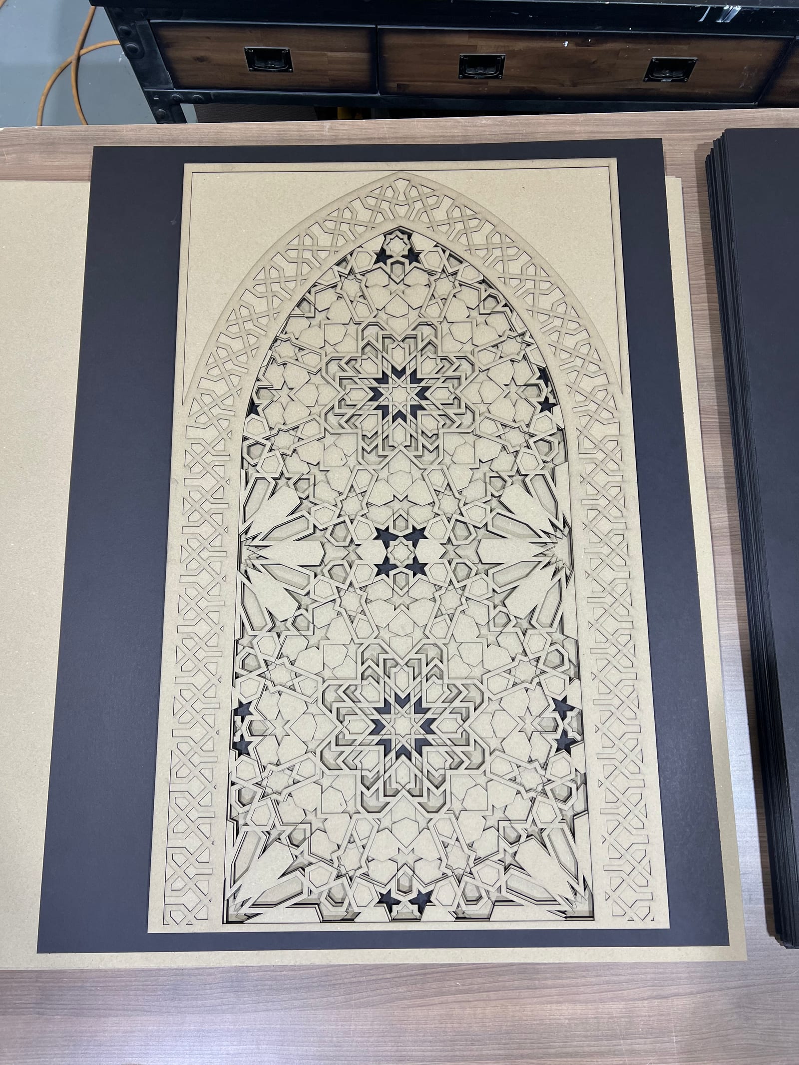 Moroccan Arch as a raw cream-on-charcoal cut sheet.