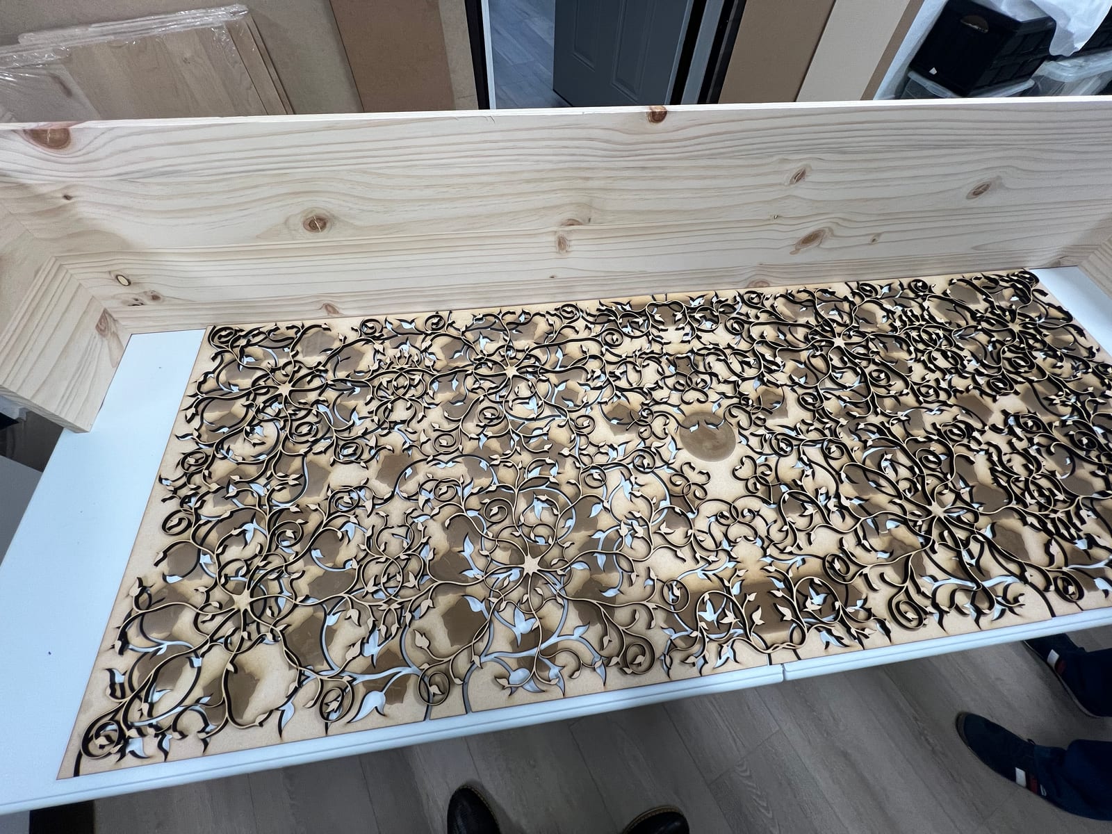 A large cut layer next to its hardwood frame.