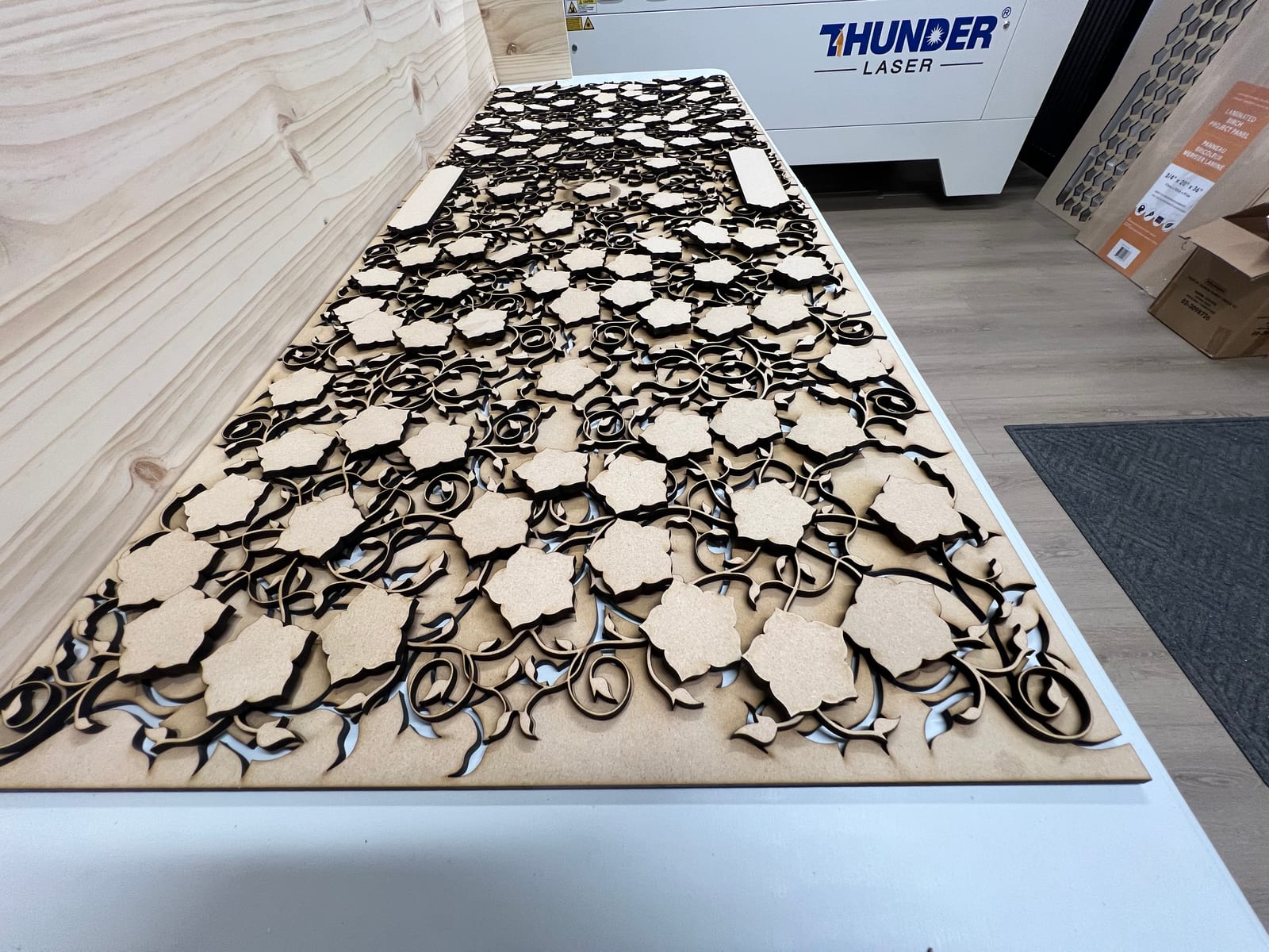 A large tracery layer on the Thunder Laser bed, mid-cut.